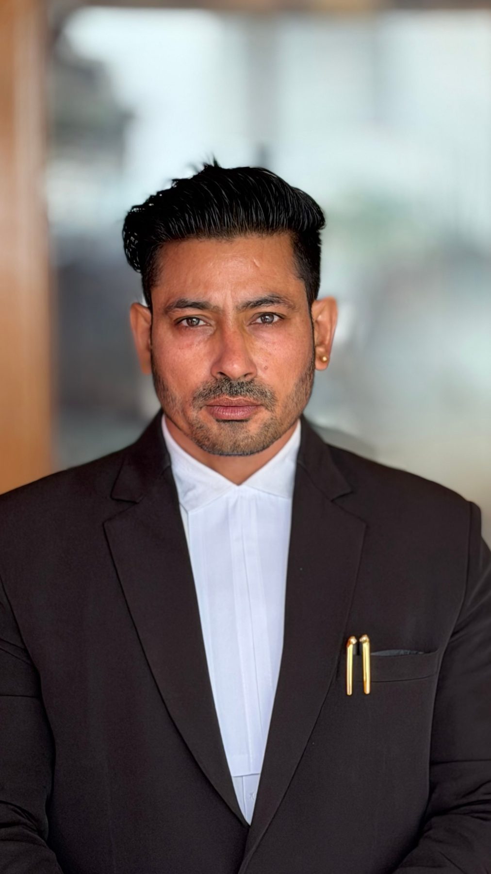Partner, in a black suit and bands